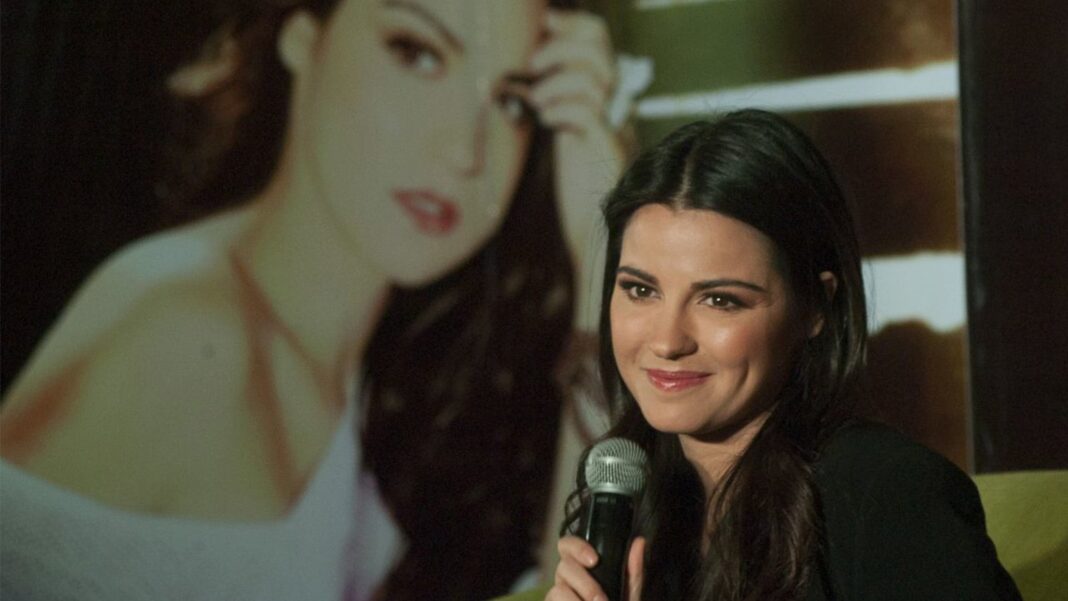 Maite Perroni y Andrés Tovar en evento público